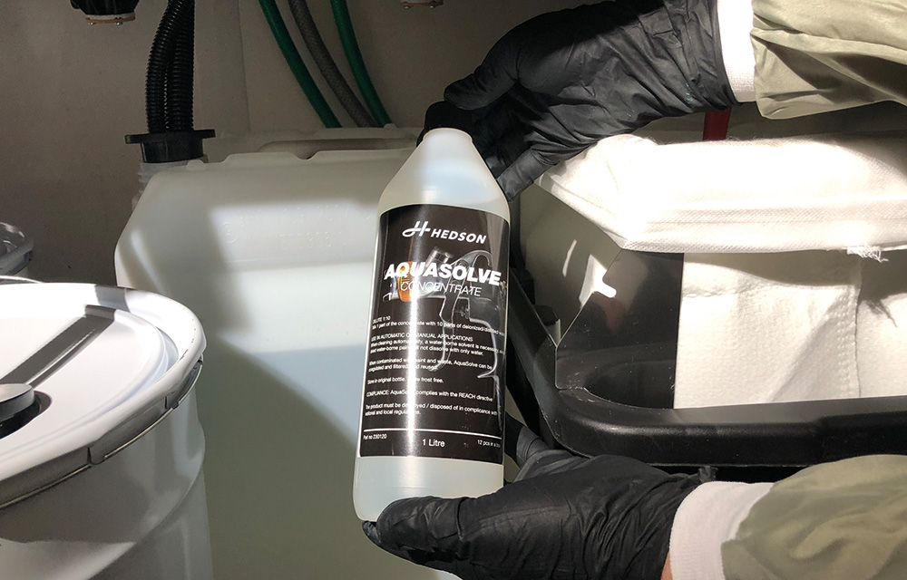 Image of AQUASOLVE; concentrate 1 Liter bottles. Package of 12. pH 7; with anti-corrosive additives to protect the gun.